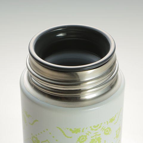 Plastic cover around the mouth of the mug for drinking comfort