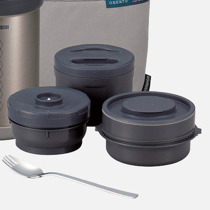 Stainless steel lunch jar with three microwaveable inner bowls, forked spoon and easy-to-carry bag